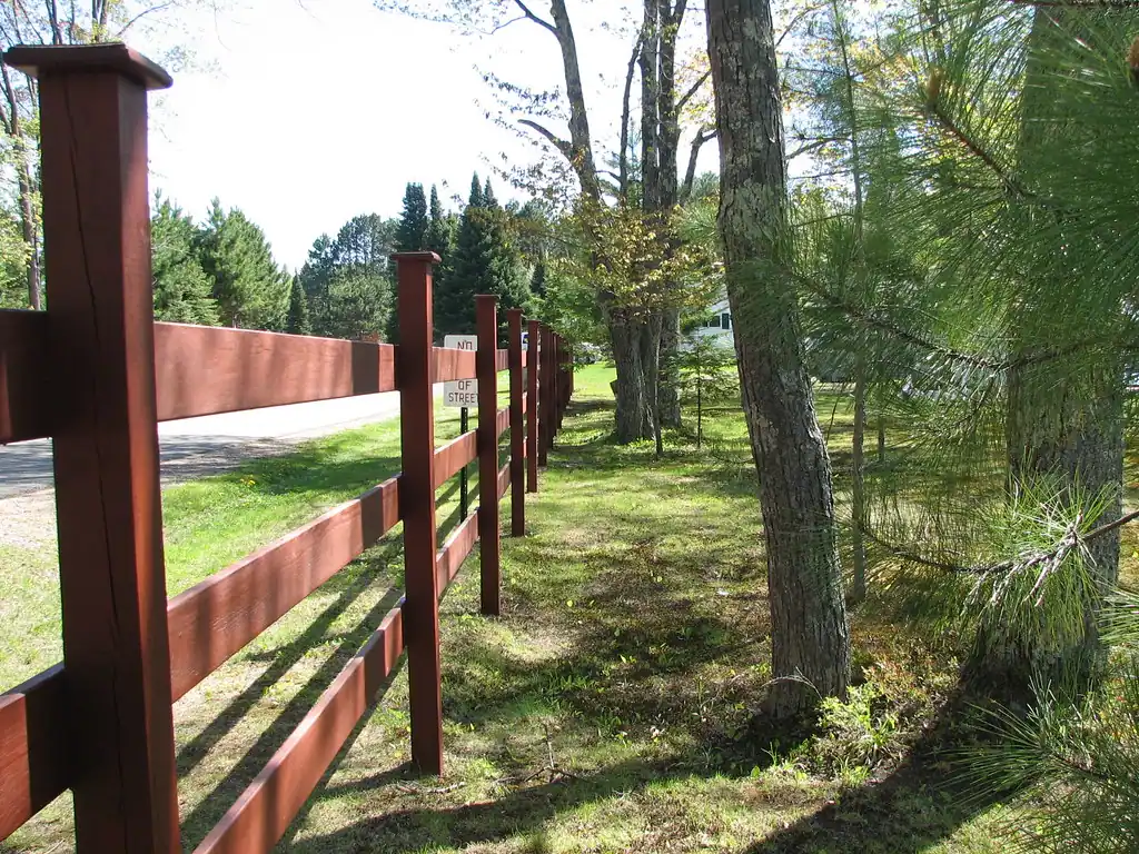 Weathered redwood board fence